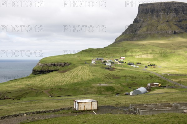 Gasadalur on the Faroe Islands as seen from the street leading towards the village on Vagar, Gasadalur, Faroe Islands, Denmark
