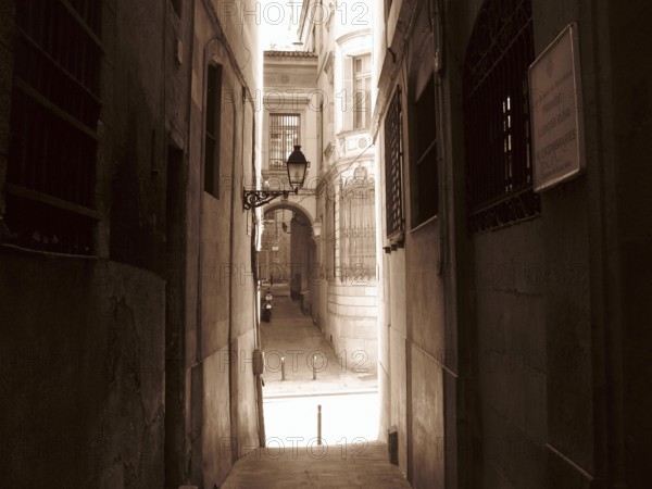 Narrow street in the city center of Barcelona, Barcelona, Spain