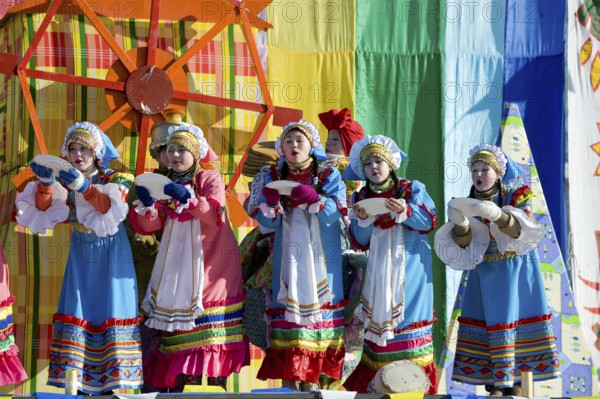 ULAN-UDE, RUSSIA - FEBRUARY 14: Dancers girls perform a Russian folk dance on the last day of the Pancake festival, February, 14, 2010, Ulan-Ude, Russia