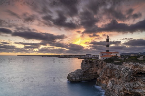 A view of the Portocolom Lighthouse in eastern Mallorca at sunset