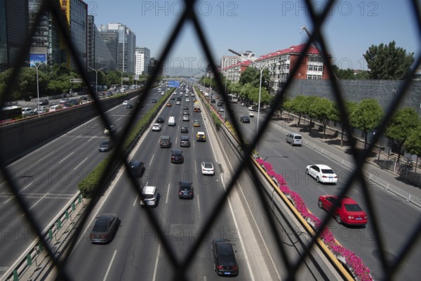 Beijing, China ? June 4 2019: Cars moving fast on a busy multi lane highway in city of Beijing in China