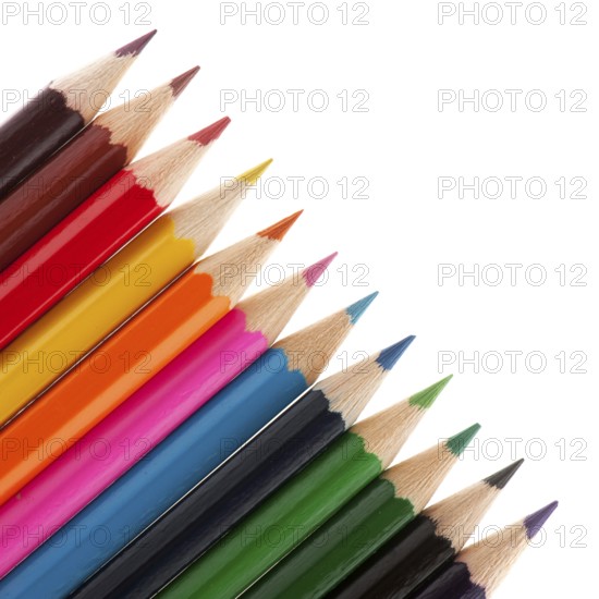 Row with color pencils on white background
