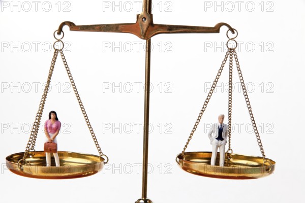 Man and woman on scales.symbol of equality