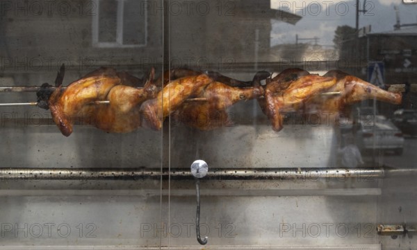 Chickens are grilled at a street cafe, Gyumri, Armenia