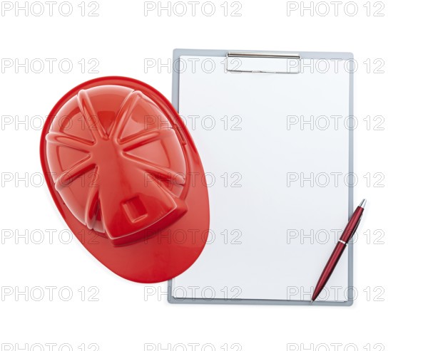 Red Construction Helmet And Ballpoint Pen On Clipboard Isolated