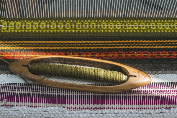 Vintage loom and yarn. Knitting carpet