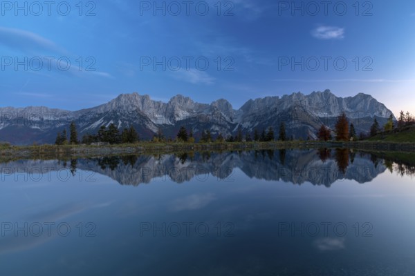 Wilder Kaiser reflected in the Astbergsee in the early morning, Going, Tyrol, Austria