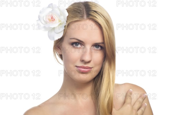 Portrait of beautiful woman with healthy skin with flower in her hair. Isolated on white background