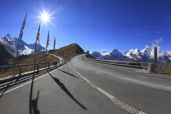 Austrian Alps. Excursion to the picturesque panoramic way Grossgloknershtrasse. Sunny day in early autumn. Great highway winds between hillsides yellowed. The picture was taken Fisheye lens