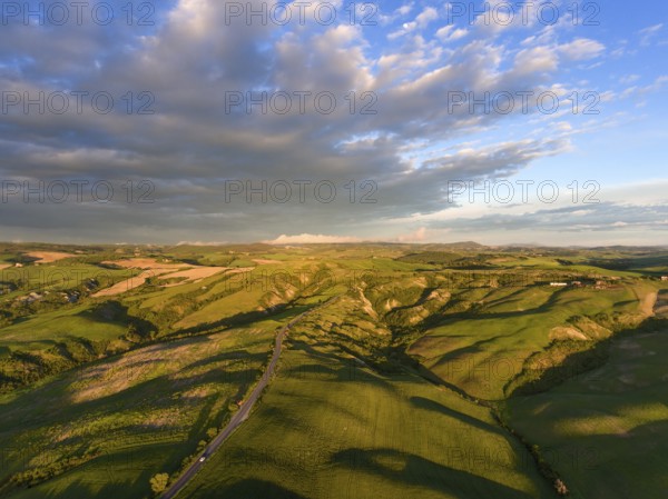 Tuscany aerial sunrise farmland hill country landscape. Italy