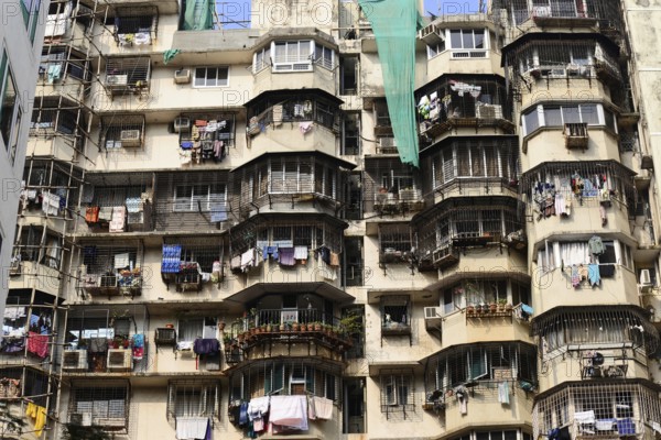 High-rise building with numerous rounded balconies and hanging laundry, Aurangabad, Mumbai, South India, India