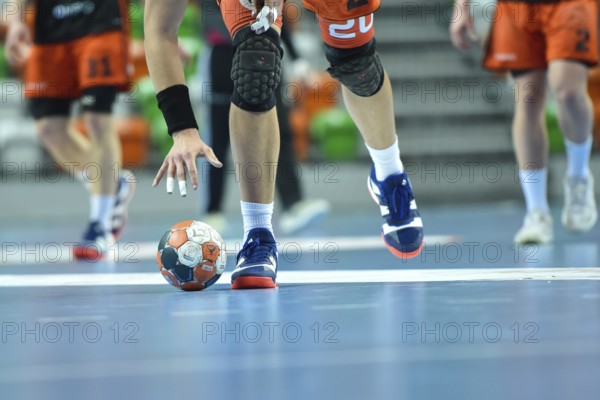 LUBIN, POLAND - MARCH 13, 2019: Polish PGNiG Superleague men in handball match between MKS Zaglebie Lubin - Energa Wybrzeze Gdansk 29:25. Player raises the ball.