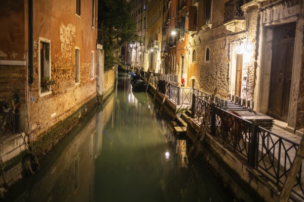 Boats in a canal, night shot, Venice, UNESCO World Heritage Site, Veneto, Italy