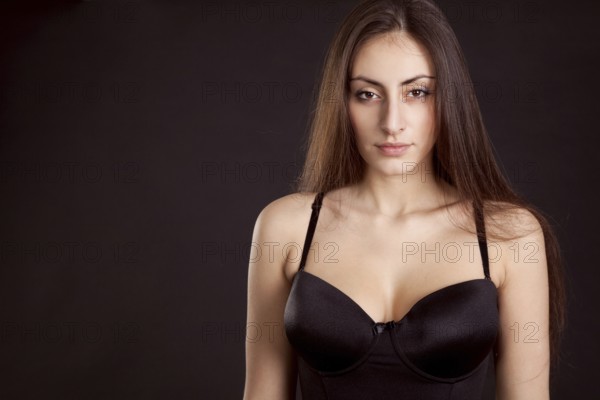 Beauty young girl face on dark background