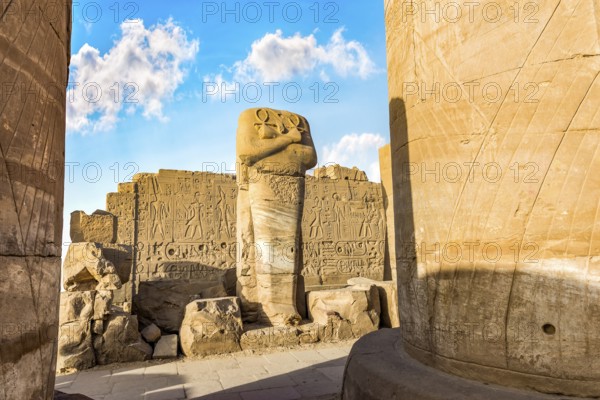 Headless statue among the ruins in Karnak Temple, Luxor