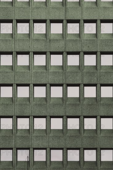 Building facade with a green grid pattern and square windows, in Rotterdam, South Holland, Netherlands