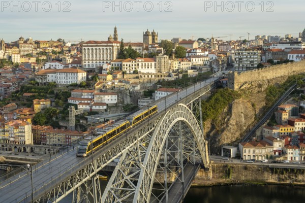 Porto City, Douro River and Dom Luis Bridge I with Tram in Morning. View from Tourist Viewpoint Miradouro da Serra do Pilar. Portugal. Medium Telephoto Shot