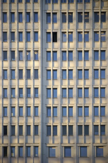 The façade of a modern office building with many windows