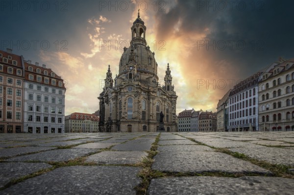 The Church of Our Lady is a baroque Protestant-Lutheran church and the defining monumental building of the Neumarkt. Romantic sunrise in the historic city centre of Dresden, Saxony, Germany