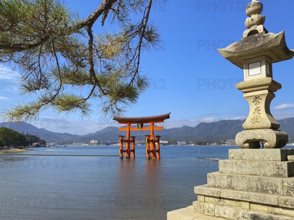 Stone lamp at the seaside close to Floating Torii gate, Hatsukaichi, Hiroshima, Japan