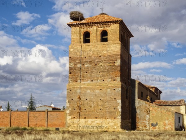 Stork nest on the bell tower of the Church of San Bartolome, Calzadilla de los Hermanillos, Castile and Leon, Spain