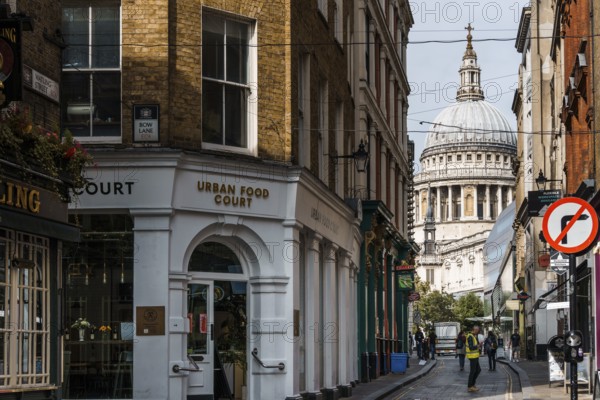 London, UK, August 25, 2023: View of Saint Paul Cathedral from Watling Street with people walking by