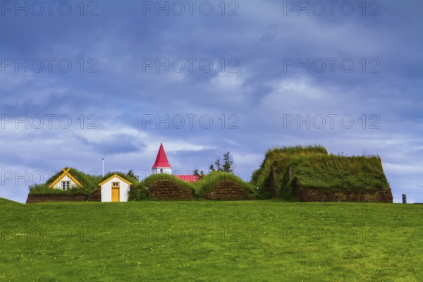 The village ancestors. The reconstituted village - a museum of the first settlers in Iceland. Roofs of houses covered with turf and grass