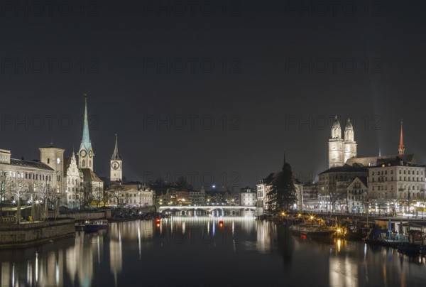 Limmat river with view of churchs in Zurich in evening, Switzerland