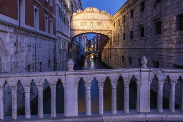 Bridge of Sighs or Ponte dei Sospiri at the Doge's Palace over the Rio di Palazzo, morning light at the blue hour, Venice, Veneto, Italy