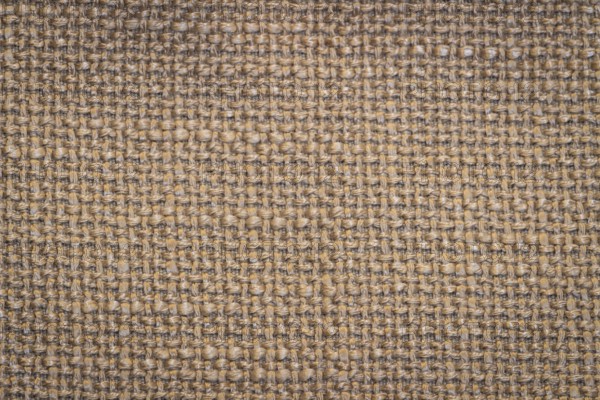 Rustic canvas fabric texture in beige colour