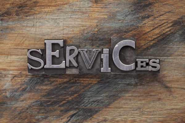 Services - word in vintage letterpress metal type blocks on a grunge painted wood