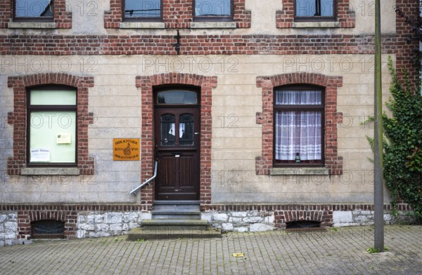Lontzen, Walloon region, Belgium July 25, 2024 - The village library, a colorful brick stone facade
