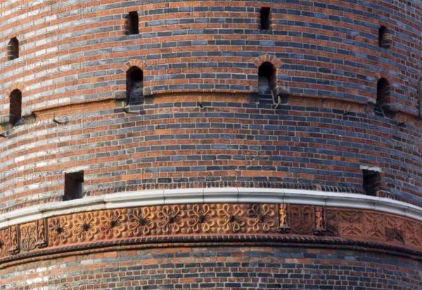 Field side with terracotta decoration