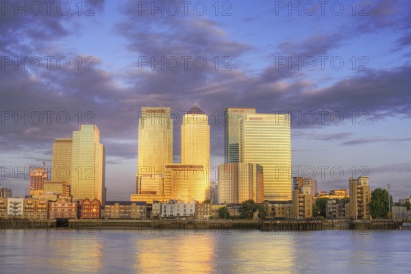 Canary Wharf District at sunrise. Canary Wharf is a commercial estate on the Northern side of the Isle of Dogs and one of the main financial centres of the UK. London England