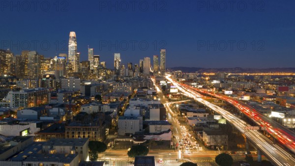 Cars go into and out of San Francisco Downtown night time rush hour