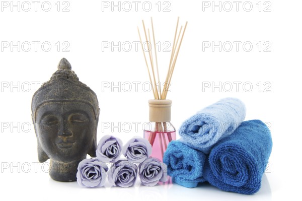 Stilllife with wellness items as buddha towels and scented sticks