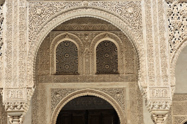 Alhambra, Granada, Andalusia, Spain, Fine arabesques and intricate architectural details in stone carving, richly decorated, Alhambra, Granada, Andalusia, Spain