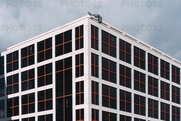 Madrid, Spain, December 5, 2021: Exterior view of modern office building in Castellana Avenue. Close-up full frame of abstract glass facade