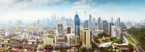 Panorama cityscape view in the middle of Kuala Lumpur city center, early morning with little mist, Malaysia