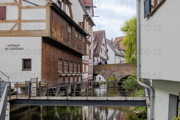 The picturesque and romantic fishermen's quarter in Ulm with the bridges over the little river Blau and the fishermen's guild house, old town view