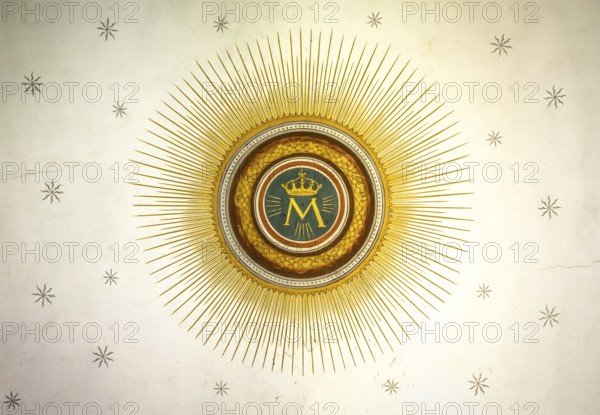 Monogram of the Blessed Virgin Mary, with crown, sun and stars on the background