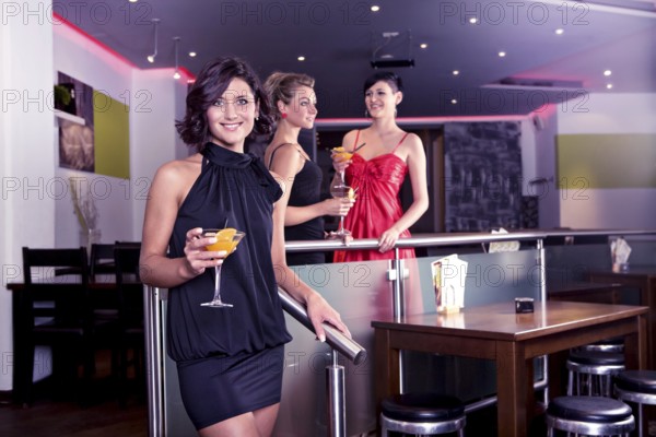 Group of young women in the bar
