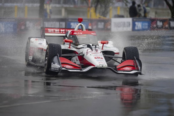 INDYCAR Series driver, STING RAY ROBB (R) (51) of Payette, Idaho, travels through the turns during a wet and dangerous practice session for the Big Machine Music City Grand Prix at Streets of Nashville in Nashville TN