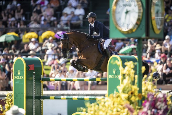 Ben Maher of Great Britain and riding Dallas Vegas Batilly compete in the first round of the 1.60m CPKC International during the Spruce Meadows Masters, presented by Rolex, in Calgary, Alberta, Canada, North America