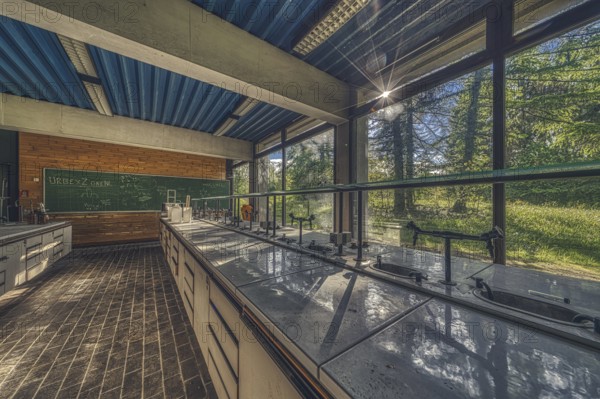 Sunlit, abandoned laboratory with old lab benches and a view of the countryside, Institute of Molecular Biology, Lost Place, Sint-Genesius-Rode, Province of Flemish Brabant, Belgium