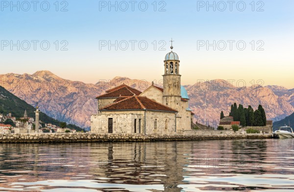 Dawn over Our Lady of the Rock island in Perast, Montenegro