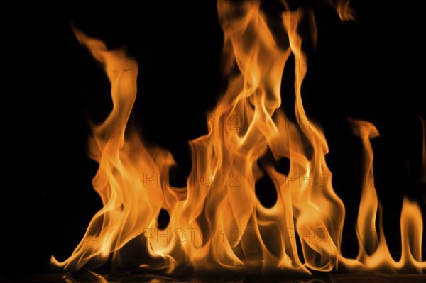 Fire flame on black background. Blaze fire flame textured background