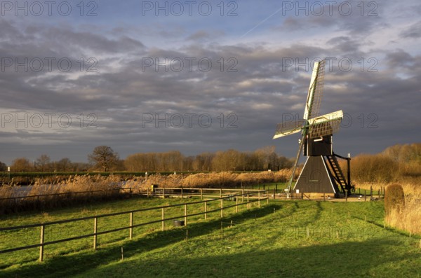 The Follega windmill near the Dutch village Laag-Keppel seen under a clouded sky just before the start of a heavy shower