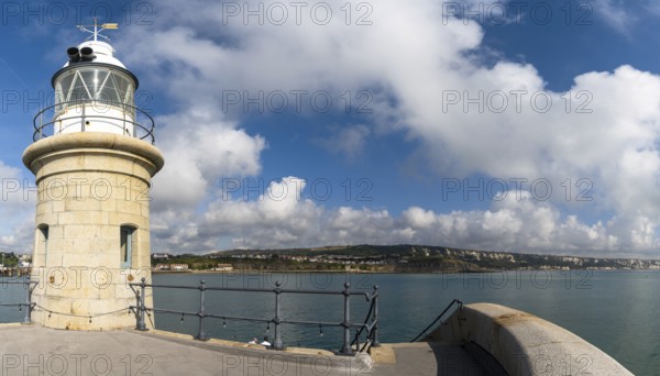 Folkestone, United Kingdom, 11 September, 2022: the Folkestone Harbor arm with the historic lighthouse