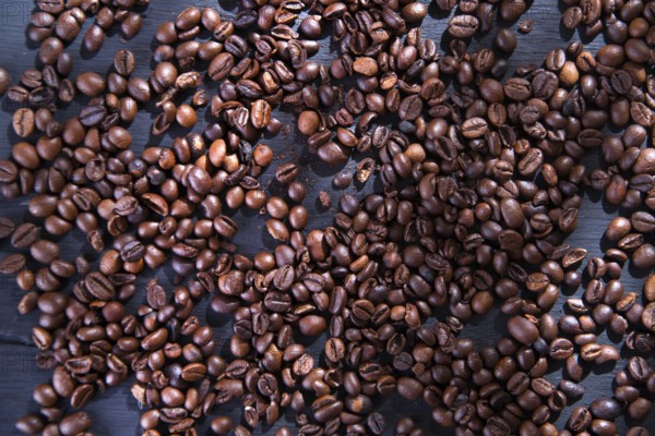 Presentation of coffee beans on the table in black